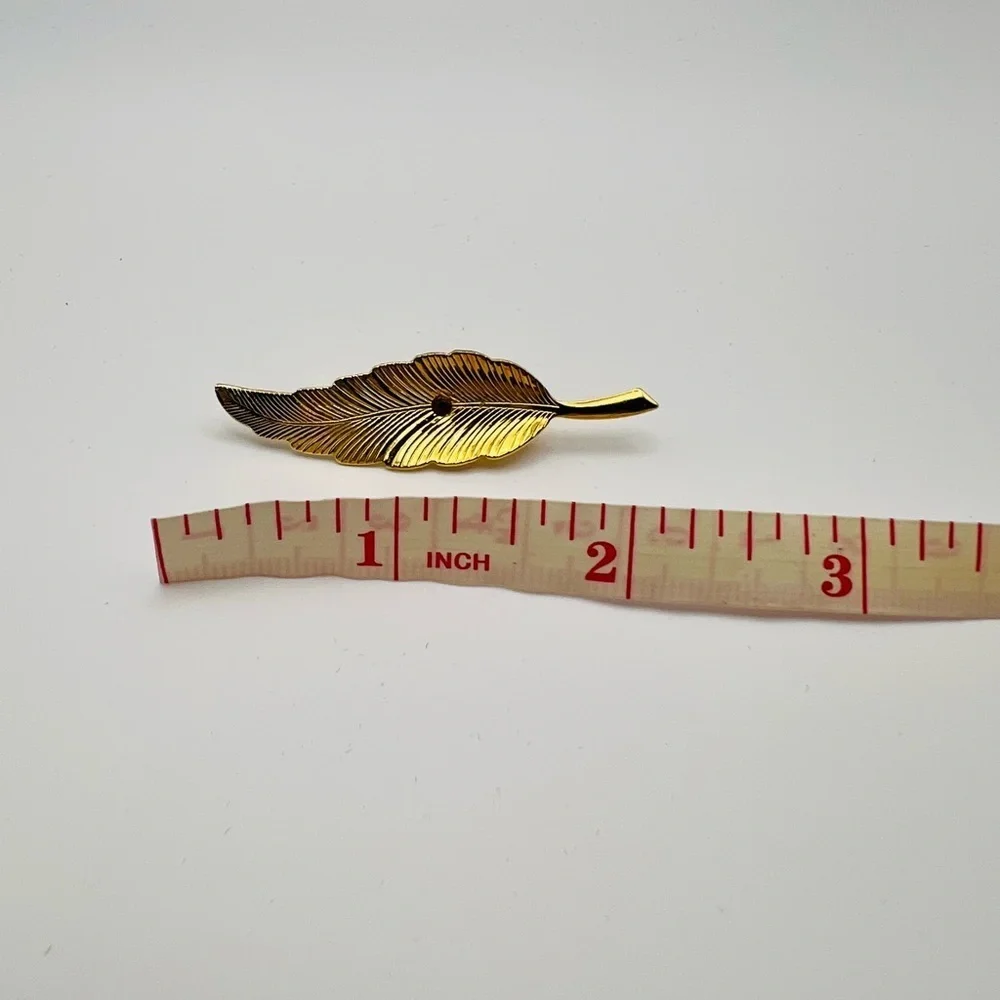 Stylish Gold and Black Feather Pin